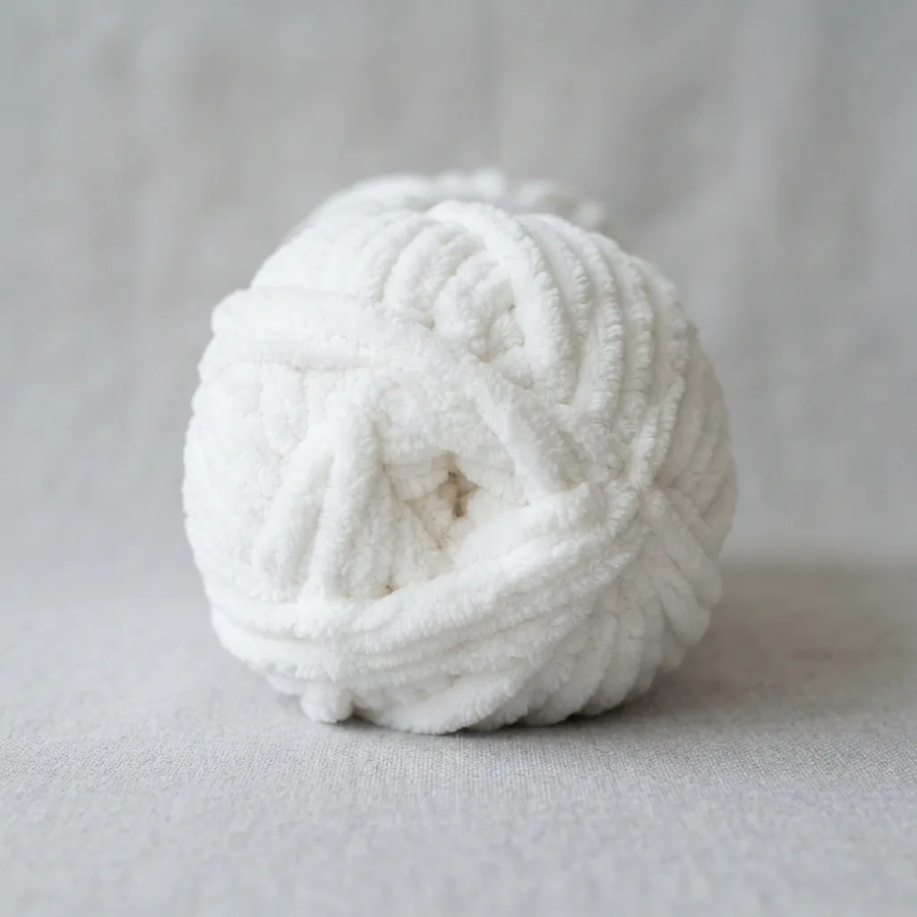A single 8.8 oz skein of white Sweet Snuggles yarn.