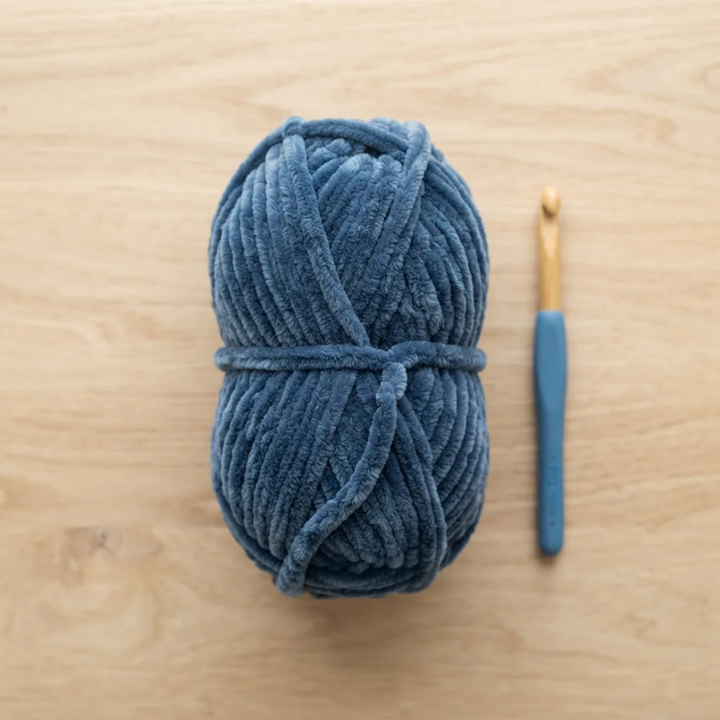 A skein of Loops & Threads Cuddly Chenille yarn in a solid color